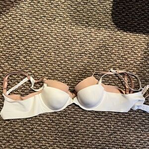 Two Victoria's Secret White and Tan Bras